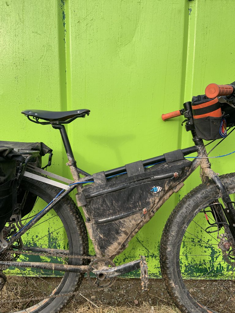Surly Pugsley against a Dumpster.